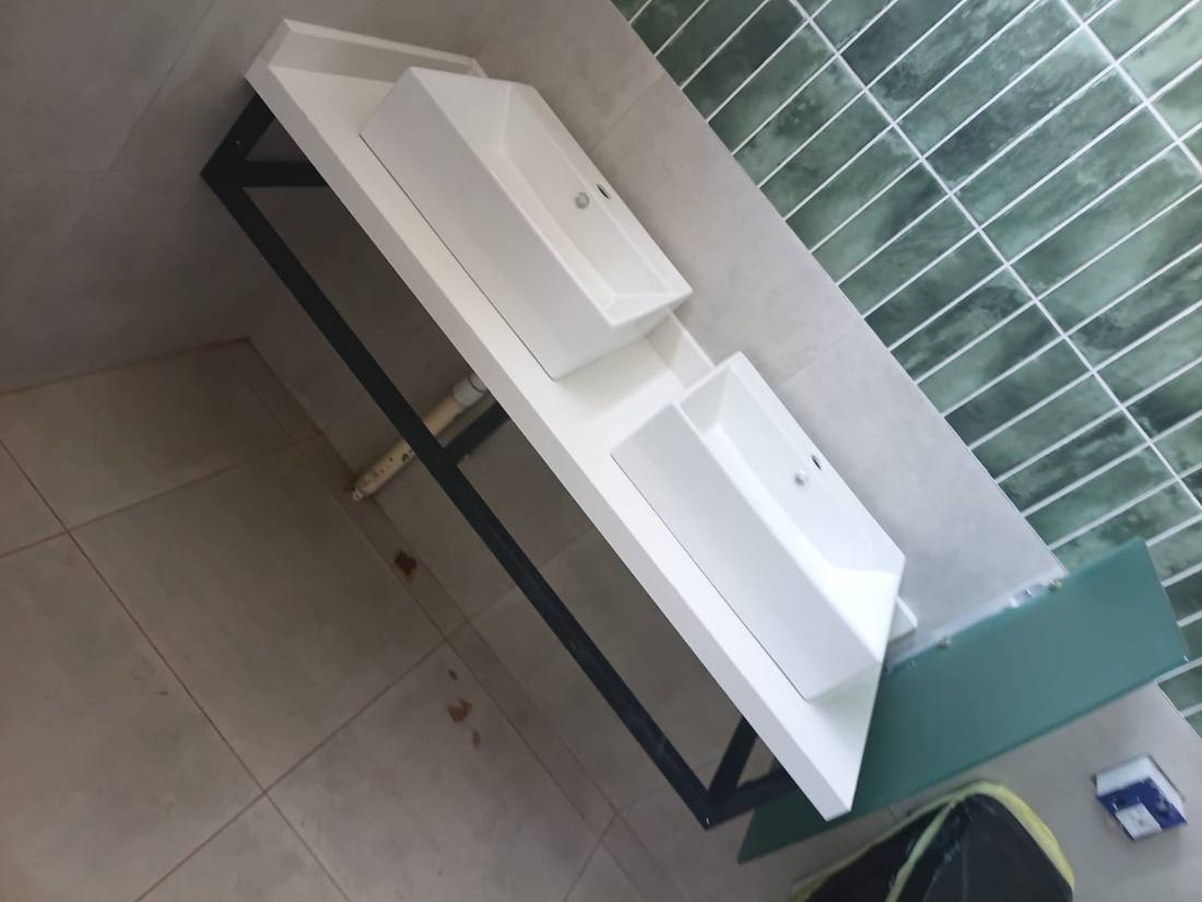 Twin countertop basins plumbed into a finished bathroom vanity