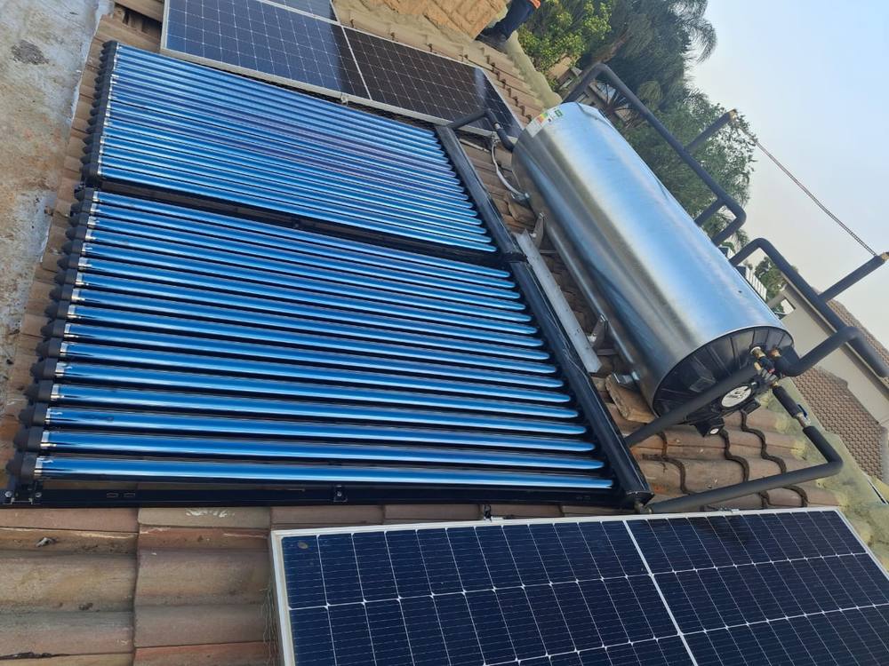 Evacuated-tube solar collector and storage tank installed on a tiled roof